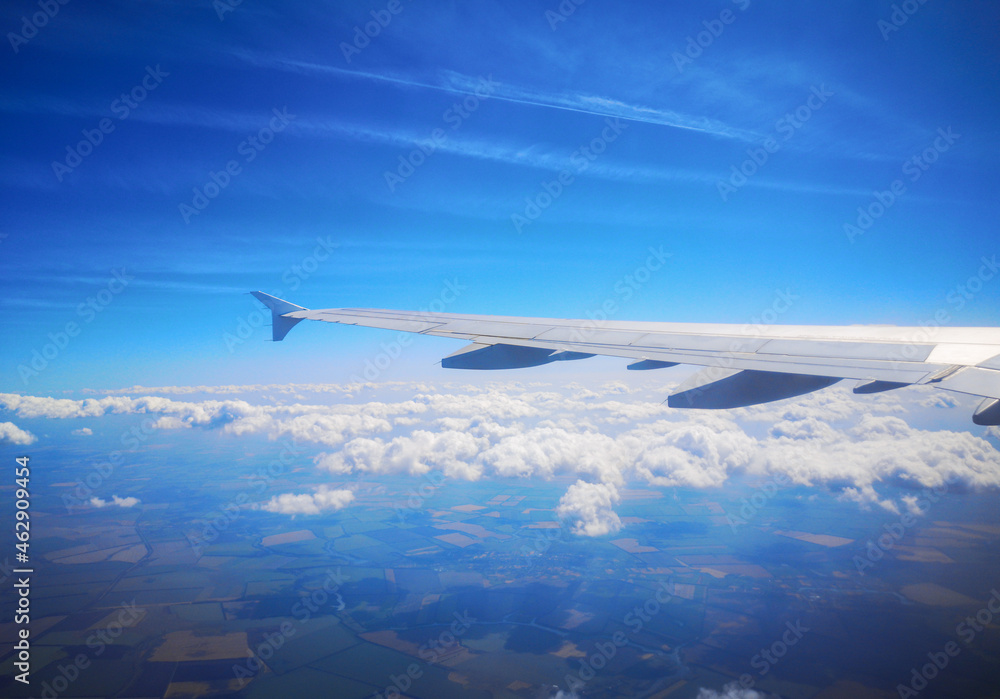Airplane wing in sky in flight. Airplane wing in sky in flight.
