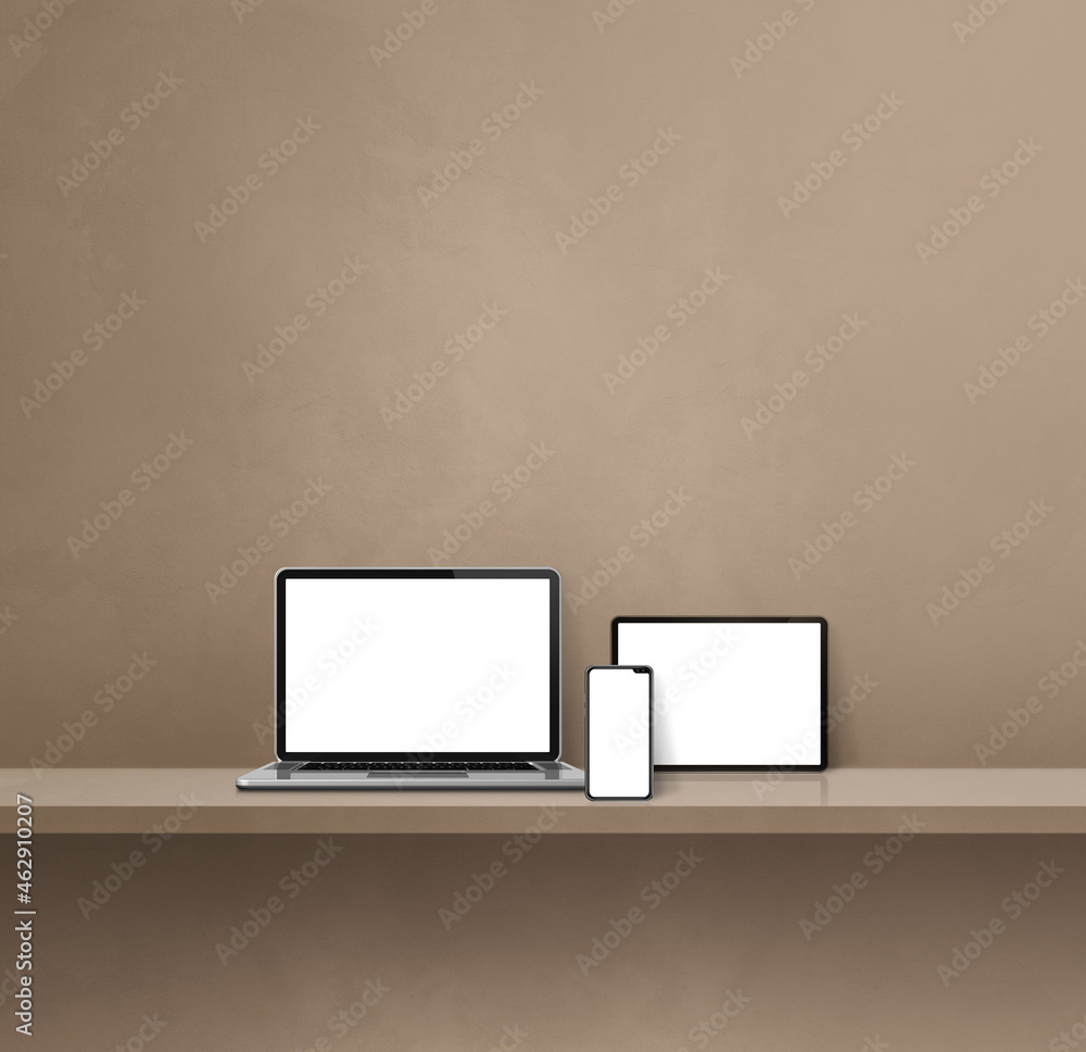 Laptop, mobile phone and digital tablet pc on brown wall shelf. Square background Laptop, mobile phone and digital tablet pc on brown wall shelf. Square background