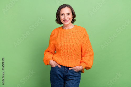 Fototapeta Photo of attractive cool grandma hands in pocket good mood casual outfit isolate
