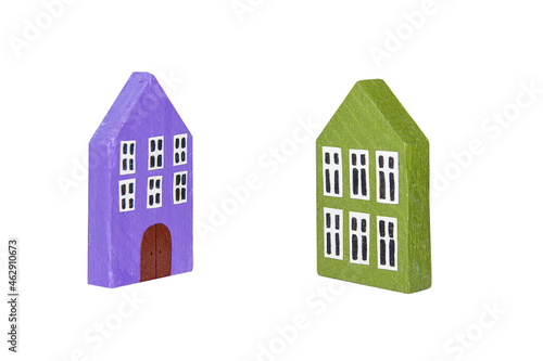 Two miniature wooden houses isolated on a white background. Two miniature wooden houses turned to each other.