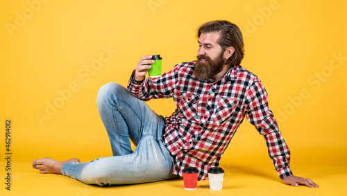 he choose this one. drinking tea or coffee. good morning. morning vibes at home. concept of inspiration. hipster man drink coffee. handsome bearded man holding cup. mug with beverage © be free