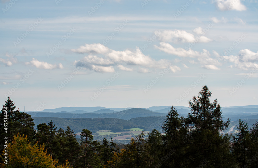 Landscape in Hessen Germany with mountains and blue sky with few clouds during summer. 