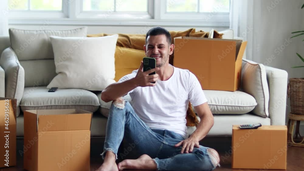 Man checking parcel box with phone and calculator.Concept online seiling. Man checking parcel box with phone and calculator.Concept online seiling.