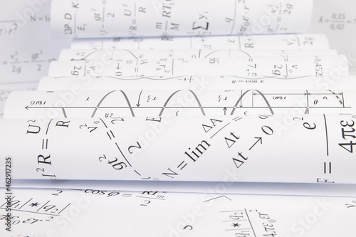 printed on paper mathematical electrical formulas, graphs and engineering drawings