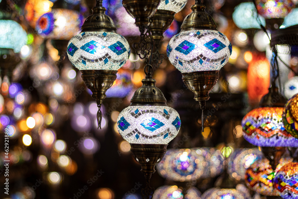 Colored decorative lanterns with different pattern. Hanging glass lamps.