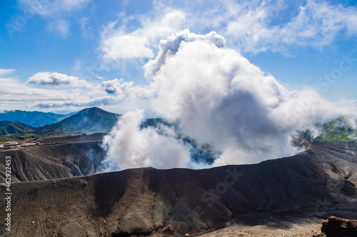 Heavy smoke bursting out from active volcano crater of Aso in Kyushu, Japan