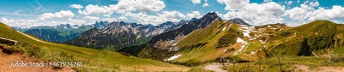 High resolution stitched panorama of a beautiful alpine summer view with the Kleinwalsertal in the background seen from the famous Fellhorn summit near Oberstdorf, Bavaria, Germany