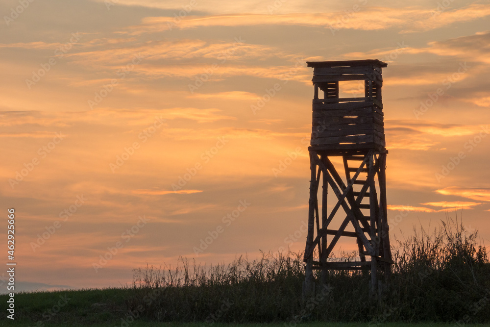 sunset in the hunting wooden shed