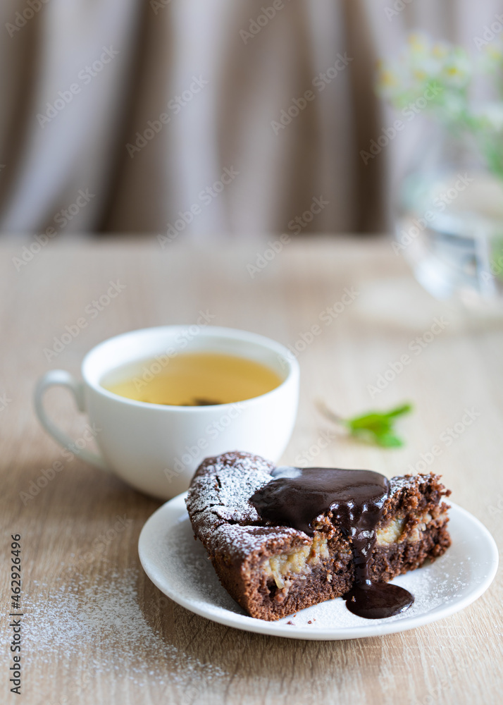 Still life with chocolate cake and cup of tea Still life with chocolate cake and cup of tea