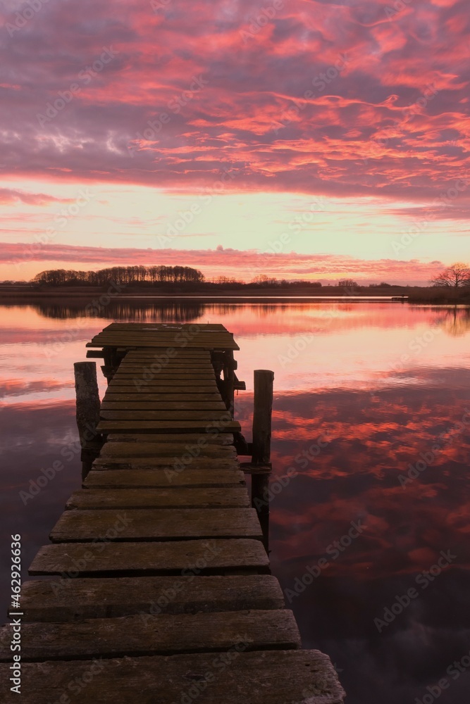 Fototapeta premium lake view with dramatic fiery sky. 