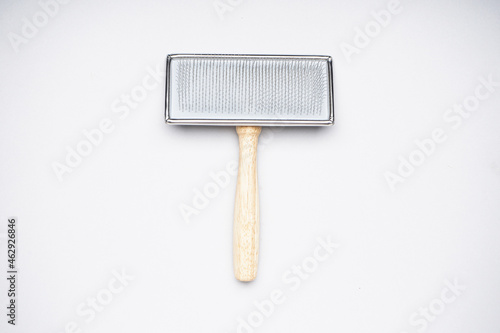 Photography Grooming brush. Brush for dogs on a white background. Flat lay.