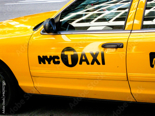 Leinwand Poster Close up of the side of a New York yellow taxi cab