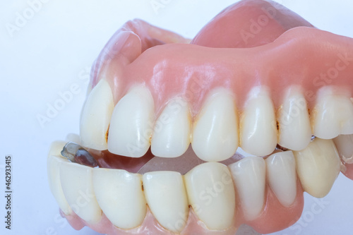 closeup of denture on a white background