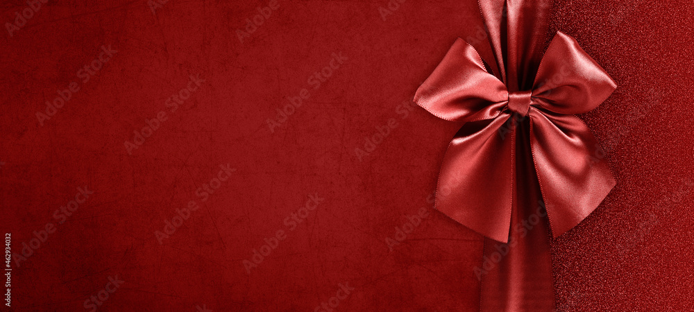 merry christmas gift card with red ribbon bow isolated on red glittering background, top view and copy space template, layout for valentine day, best wishes or tagging shopping merry christmas gift card with red ribbon bow isolated on red glittering background, top view and copy space template, layout for valentine day, best wishes or tagging shopping