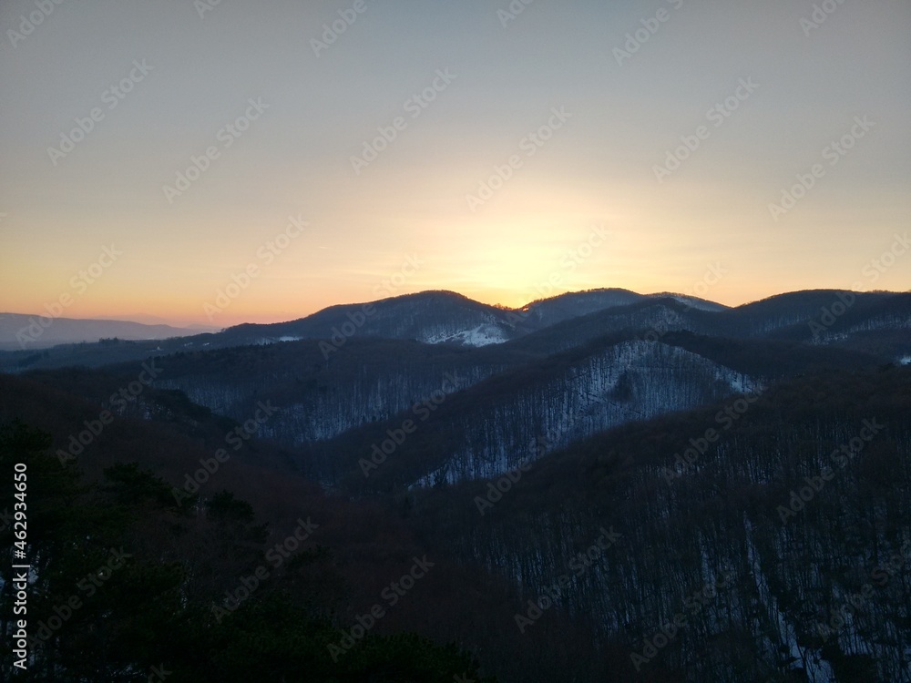 Wonderful winter moody sunset in an austrian forest landscape Wonderful winter moody sunset in an austrian forest landscape