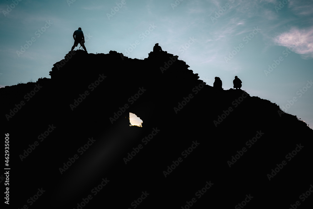 silhouette of a person and mountain