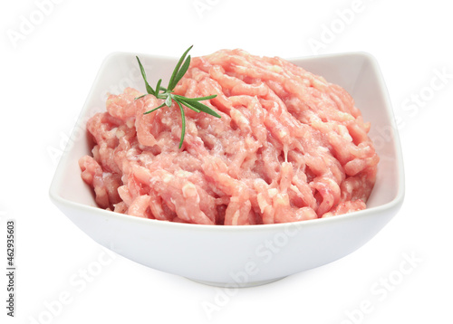 Raw chicken minced meat with rosemary in bowl on white background