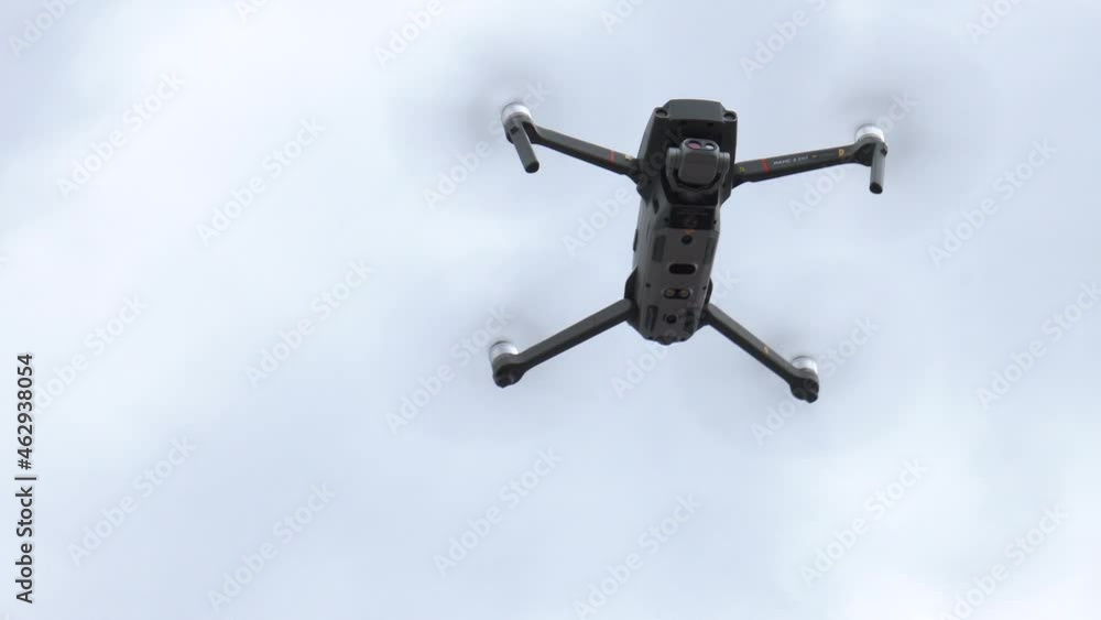 drone quad copter with high resolution digital camera on the sky. Drone with camera flying over blue sky background drone quad copter with high resolution digital camera on the sky. Drone with camera flying over blue sky background