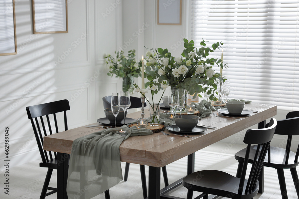 Festive table setting with beautiful tableware and decor indoors Festive table setting with beautiful tableware and decor indoors