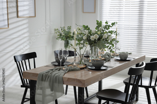 Festive table setting with beautiful tableware and decor indoors