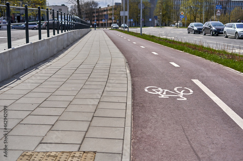 Wallpaper Mural Pedestrian path with red bicycle lanes on the right side Torontodigital.ca