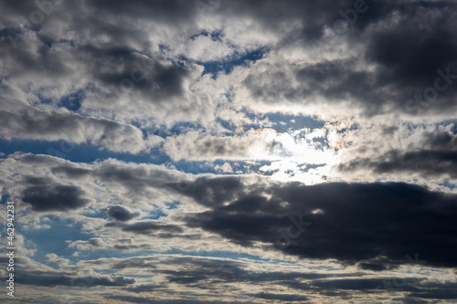 Sky covered with clouds with glimpses of sunbeams