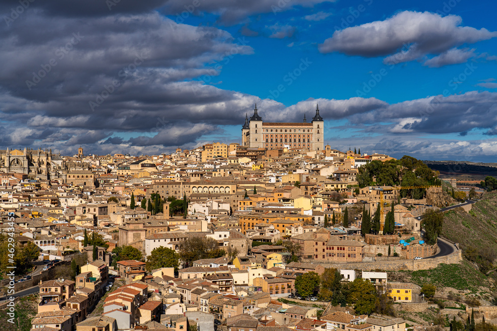 Toledo, Spain. Old city with its Royal Palace over the Tagus River sinuosity Toledo, Spain. Old city with its Royal Palace over the Tagus River sinuosity