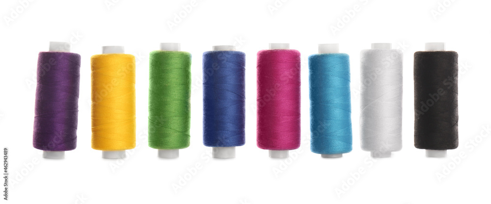 Set of colorful sewing threads on white background Set of colorful sewing threads on white background