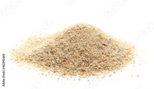 Bread crumbs pile isolated on white   photo