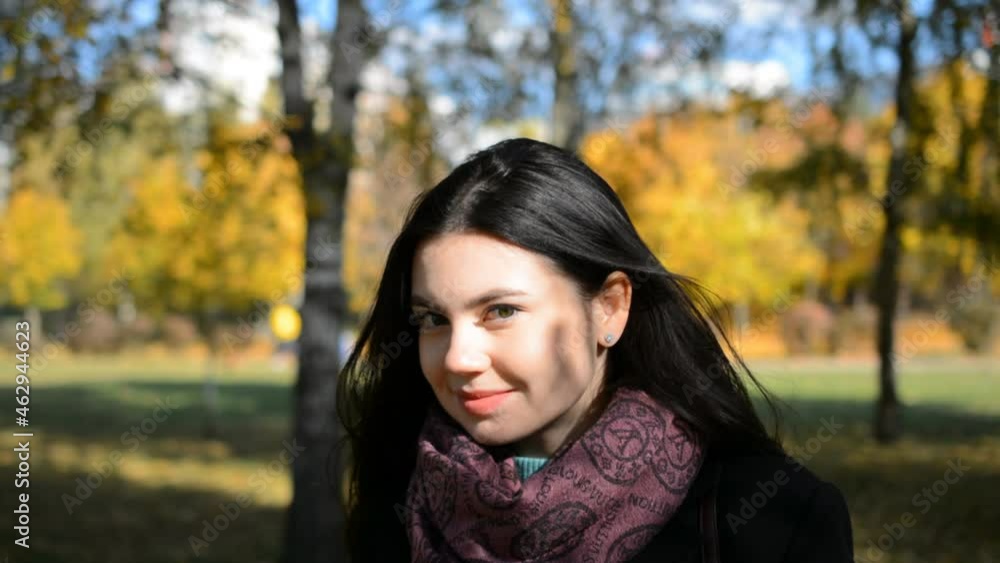 Beautiful brunette girl portrait smiling in autumn park Beautiful brunette girl portrait smiling in autumn park
