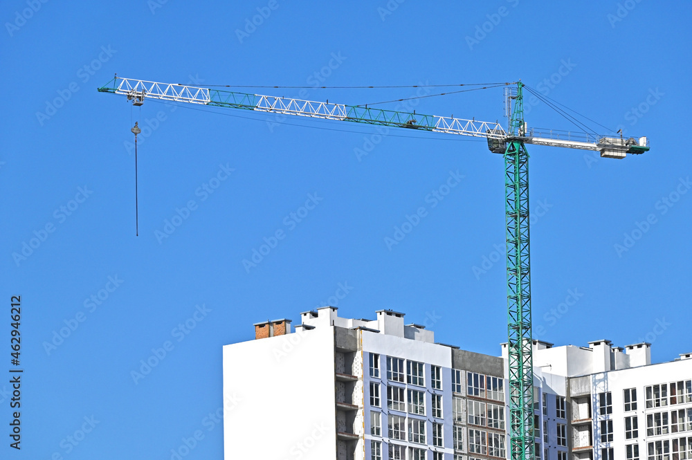 Crane and highrise construction site Crane and highrise construction site