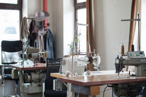 Used sewing machine and sewing tools in fashion atelier  selective focus