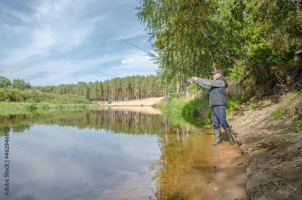 Fisherman on the bank of a beautiful river. Fisherman on the bank of a beautiful river.
