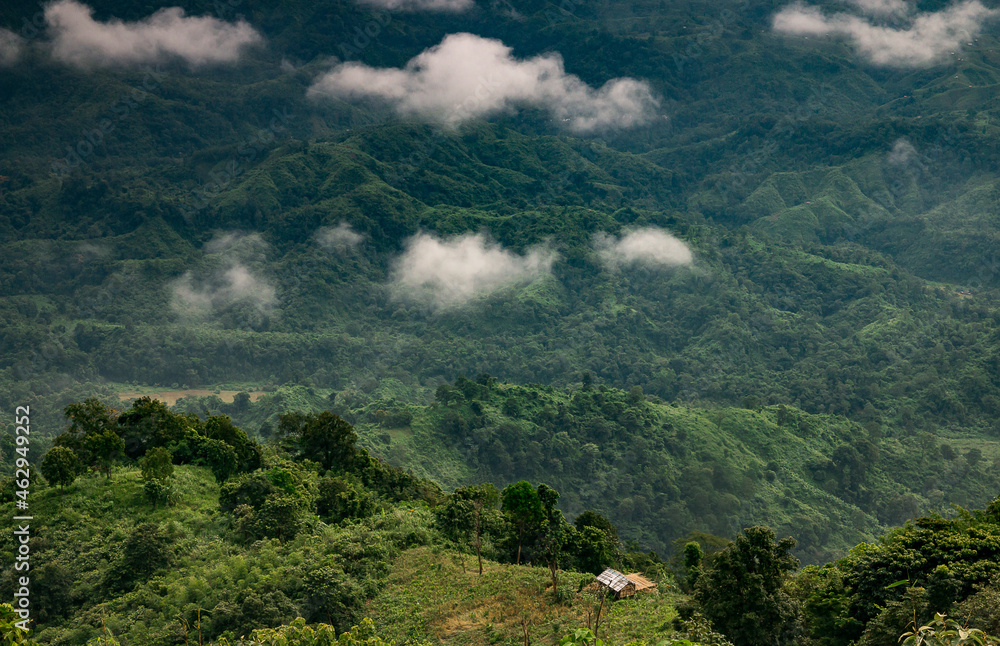 Floating clouds over green hills Floating clouds over green hills