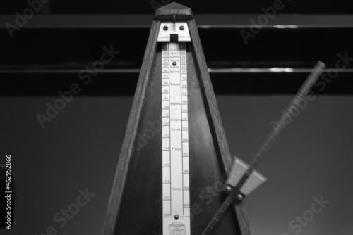 black and white mechanical metronome beating time 