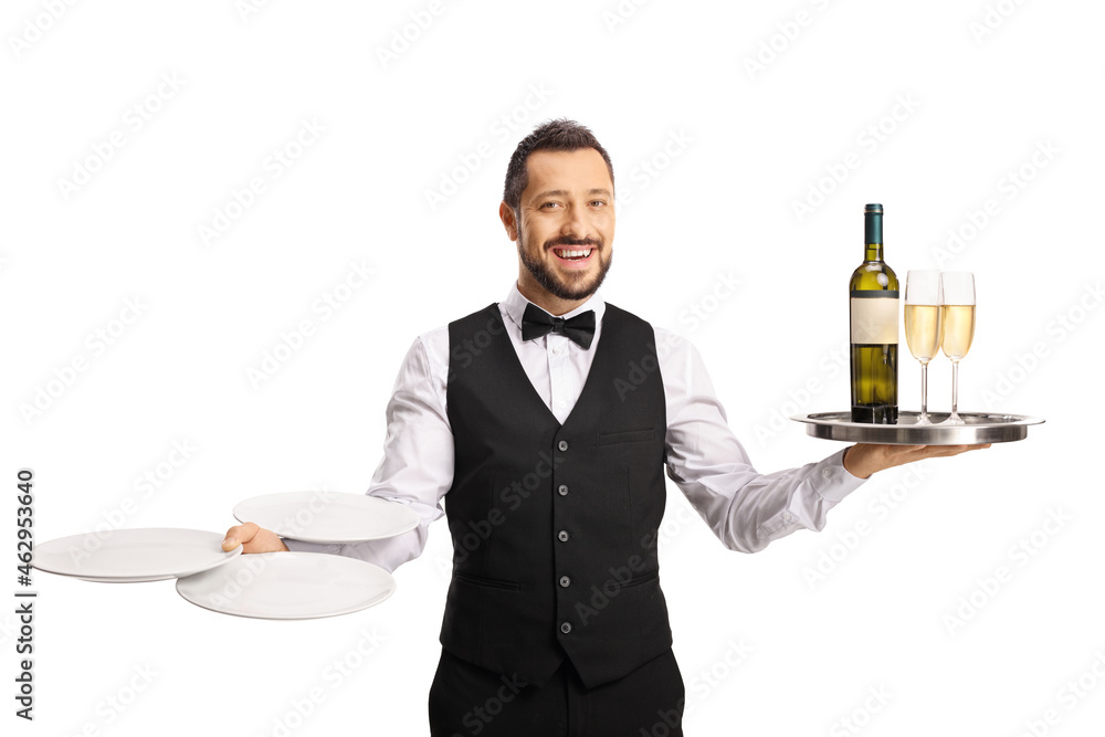 Cheerful waiter carrying wine on a tray and plates Cheerful waiter carrying wine on a tray and plates