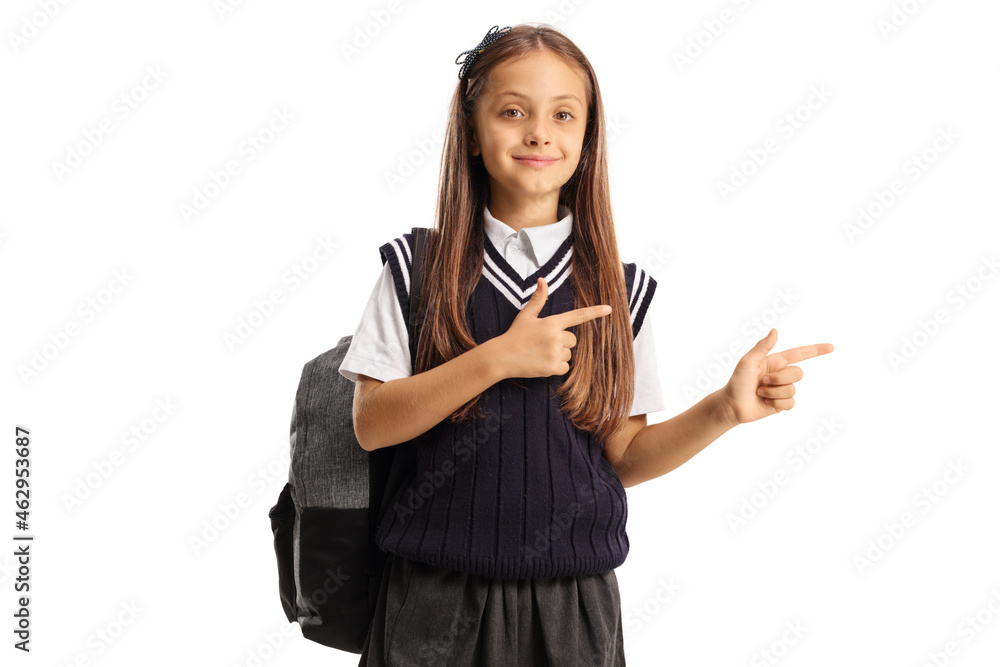 Schoolgirl with a backpack and a uniform pointing Schoolgirl with a backpack and a uniform pointing