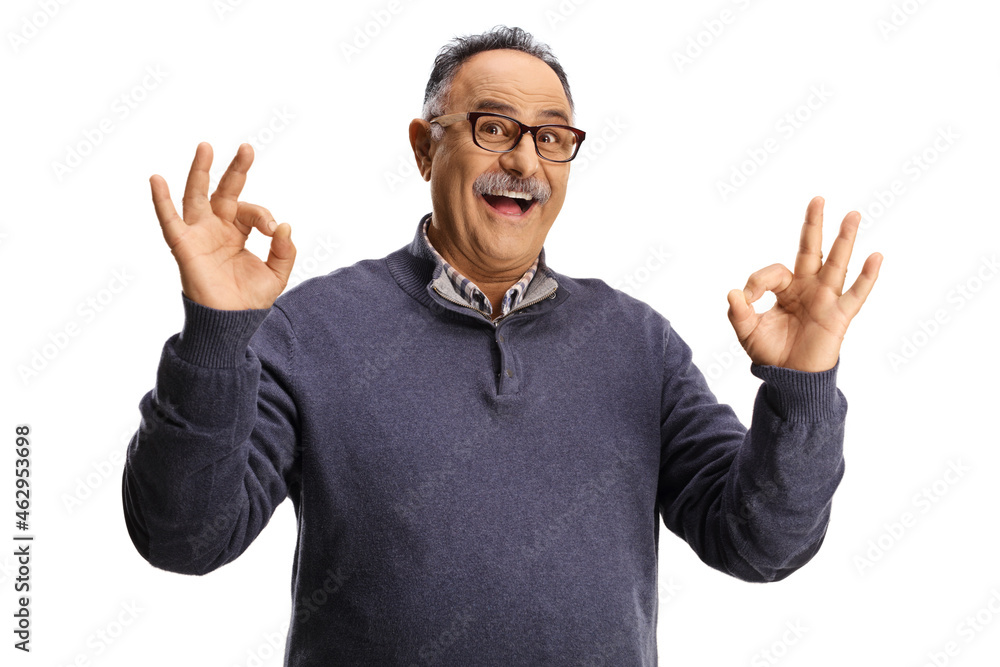 Fototapeta premium Mature man smiling and gesturing ok sign
