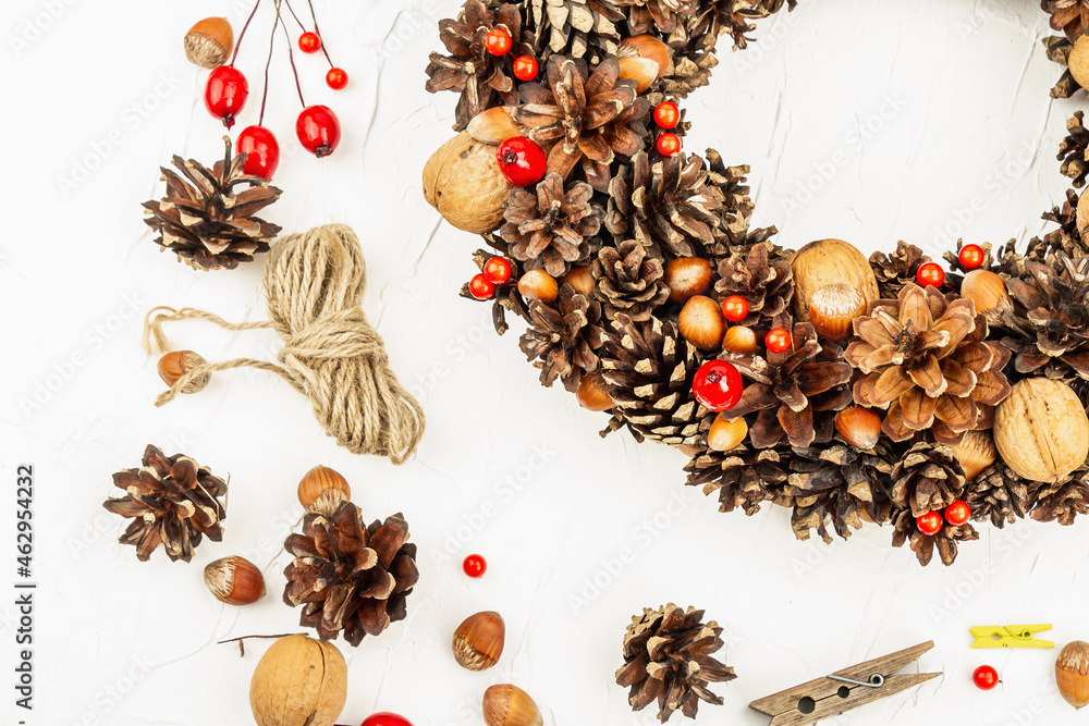 Autumn wreath of cones, nuts, and berries. Assortment from natural materials Autumn wreath of cones, nuts, and berries. Assortment from natural materials