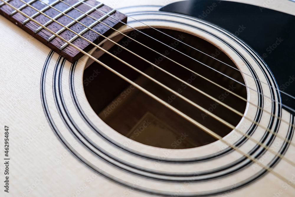 Obraz premium Details of classic acoustic guitar, strings and chords, guitar neck close up