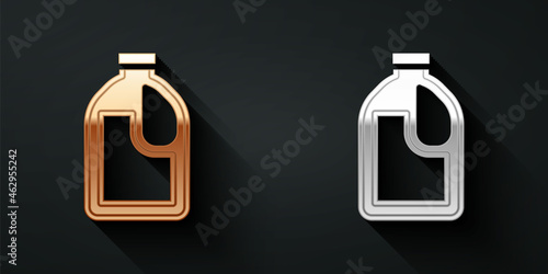 Gold and silver Plastic bottle for laundry detergent, bleach, dishwashing liquid or another cleaning agent icon isolated on black background. Long shadow style. Vector