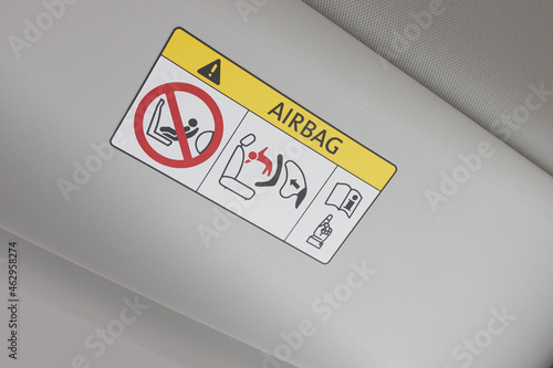 Airbag instruction sign. Forbidden information for using infant car seat on the car dashboard. Caution airbag logo. - Image photo