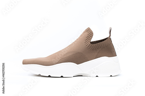 modern beige sneakers with white soles isolated on white background - Image