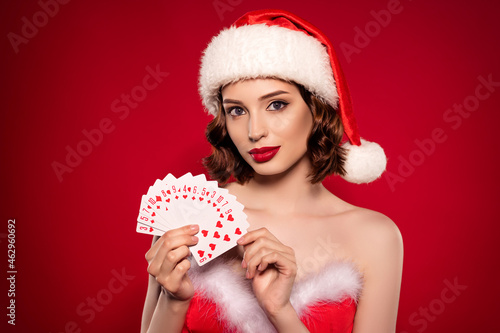 Photo of young cool tender lady play poker festive occasion party isolated on dark maroon gradient background