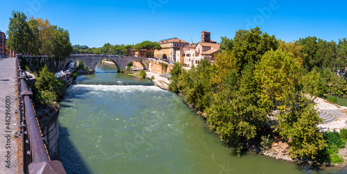 Rome - The Isola Tiberiana - Tiberian Island with the Ponte Cestio bridge. photo