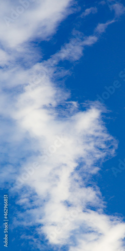 vertical panoramic of clouds over a blue sky wallpaper