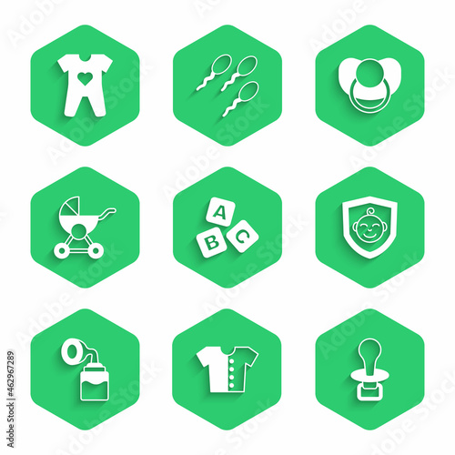 Set ABC blocks, Baby t-shirt, dummy pacifier, on shield, Breast pump, stroller, and clothes icon. Vector