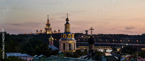 Russia. Moscow after sunset. Panorama of the Moscow State University and the Luzhniki bridge from the observation deck over the Andreevsky Monastery