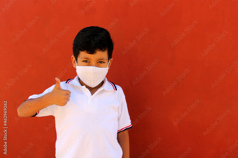 Happy and pensive Latino 8 year old boy wearing white school uniform