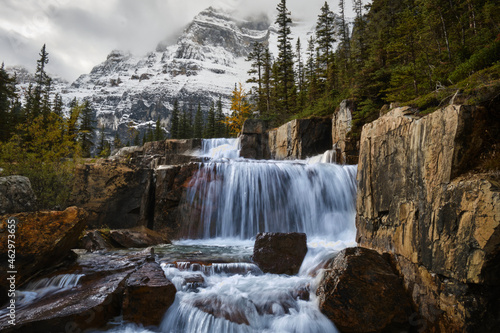 Giant Steps Waterfalls against Mt. Lefroy covered with fresh snow in autumn. Banff National Park. Canadian Rockies. Alberta. Canada